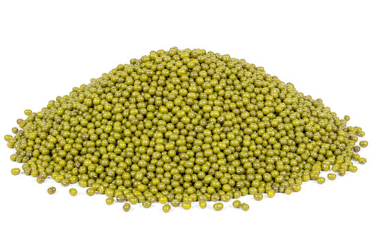 A dense, vibrant green pile of raw moong dal, a healthy and protein-rich legume, presented on a clean white background. This essential ingredient is perfect for diverse culinary applications