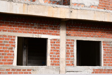 Obraz premium exterior view of brick house under construction with concrete structure