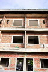 Obraz premium exterior view of brick house under construction with concrete structure