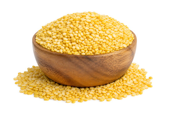 Studio shot of yellow split moong dal in a wooden bowl