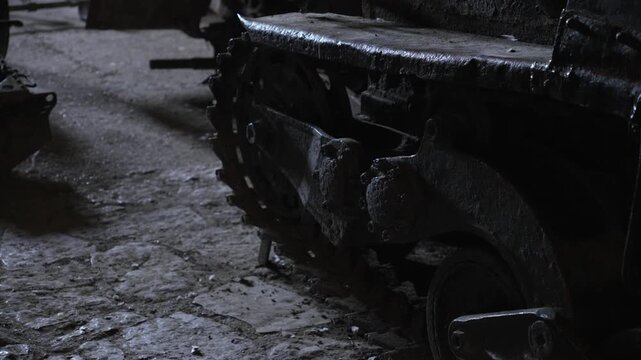 Heavy metal caterpillar tracks and drive sprocket of an armored military vehicle tank