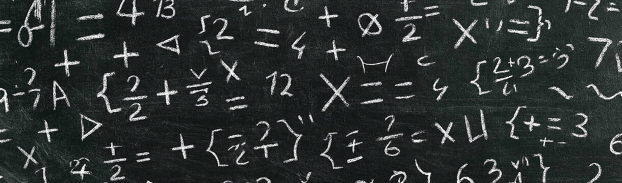 Mathematics Formulas on Chalkboard: A compilation of various mathematical equations and symbols scribbled on a dark chalkboard, representing knowledge and abstract thought.