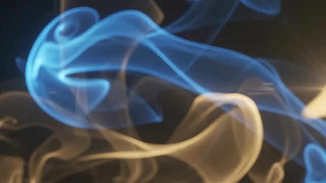Abstract wisps of vibrant blue and warm golden smoke curve gracefully across a dark textured background, illuminated by soft atmospheric lighting that highlights their delicate silky texture.