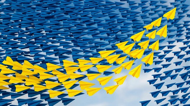 Distinctive business strategy concept featuring bright yellow paper airplanes breaking away from a vast swarm of blue paper planes soaring against a clear sky, symbolizing leadership and innovation