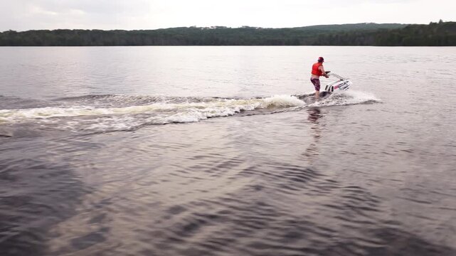 Stand up jet ski on a calm summer lake in the north on fresh water