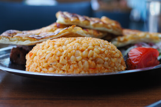 a portion of traditional Turkish bulgur pilaf served on a metal plate