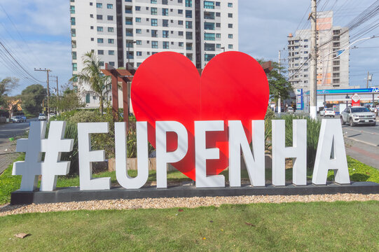 Penha, Brazil - September 7, 2026: View of the colorful tourist landmark sign spelling Eu amo Penha with a heart symbol along the beachfront.