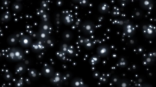 黒背景に無数の銀色の光の粒が舞い上がる4Kシームレスループ 合成用オーバーレイ素材