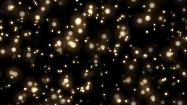 黒背景に無数の琥珀色の光の粒が舞い上がる4Kシームレスループ 合成用オーバーレイ素材