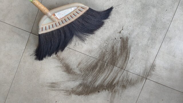 Sweeping up volcanic ash produced by the eruption of Anak Krakatau. The ash drifted hundreds of kilometers across the island of Java.