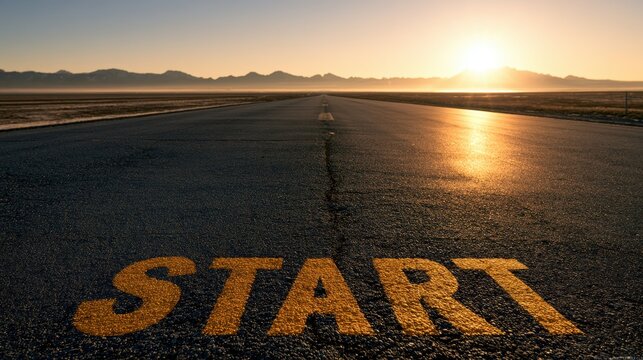 Empty asphalt road with a sign start against sun, golden hour light.