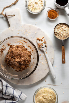 Ingredients in a bowl mixed together for making high protein energy balls.