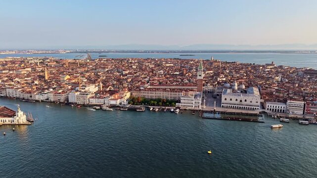Aerial drone view of St Mark's Square, the bell tower and the Doge's Palace on the waterfront of the old city, Venice, Italy