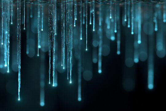 Luminous icicles hang in cool, glowing blue tones. They shimmer against a dark, blurred background. Each icicle pulses with soft, ethereal light. The scene evokes quiet, frosty serenity
