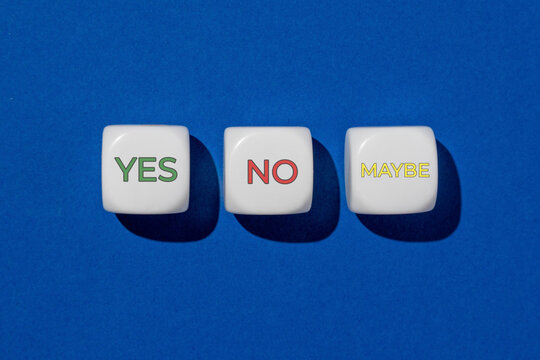 Three white dice displaying the words YES, NO, and MAYBE on a blue background. Decision making, choices, survey options, uncertainty concept.