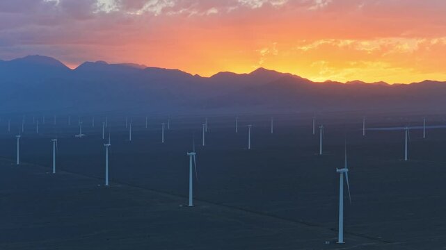 Wind farms at sunset in the Gobi Desert, windmills generating electricity, new energy.