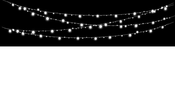 Glowing white string lights hanging against a black background
