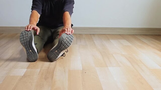 Seated workout routine showing toe touch stretching followed by ping pong ball juggling on floor