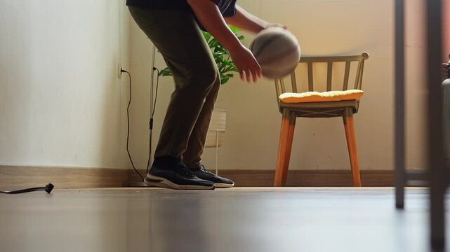 Close-up on legs as player dribbles basketball in figure eight pattern for skill practice