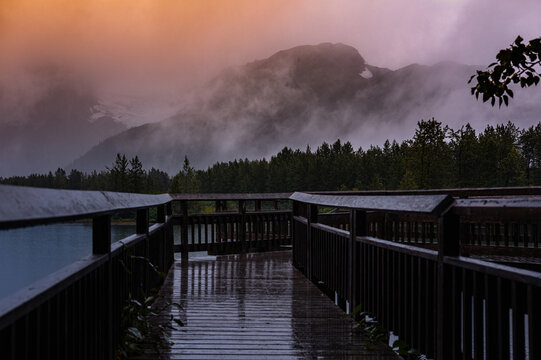 Alaska autumn sunset landscape at Moose Flat Lake Obervation Deck on a foggy rainy evening in Girdwood, south of Anchorage, USA
