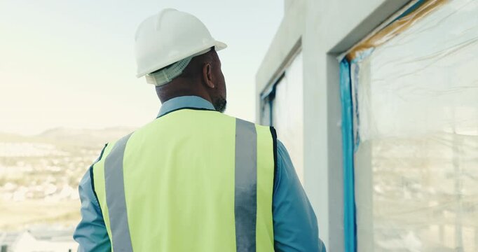 Back, man and engineer at site for construction, inspection and building progress for expansion. Male person, contractor or walking outdoor for supervision, quality assurance and architecture project