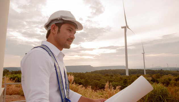 Wind Turbine Engineer Inspecting Project: A focused engineer, wearing a hard hat and safety vest, holds blueprints while overlooking a wind farm at sunrise, symbolizing renewable energy development.