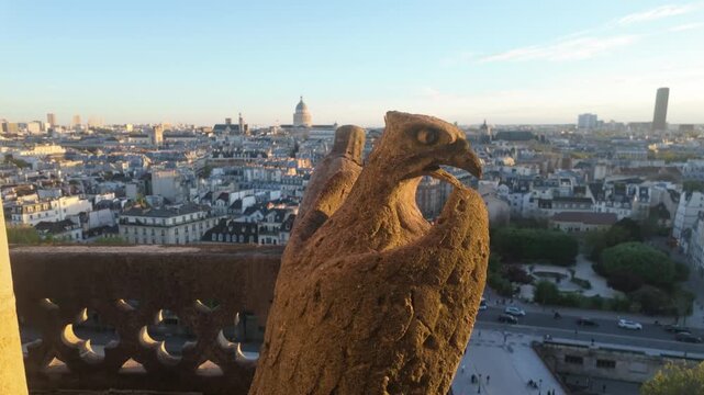 A bird statue over the city of Paris.