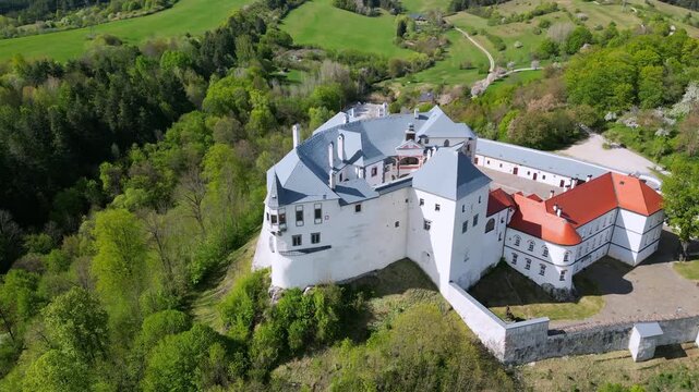 Aerial view of the medieval Slovenska Lupca Castle, a significant historical monument situated on a hill in central Slovakia