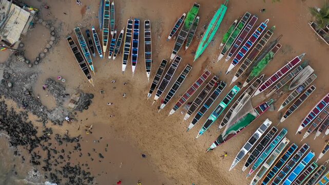 Aerial view traditional pirogue fishing boats. Authentic African coastal tourism lifestyle