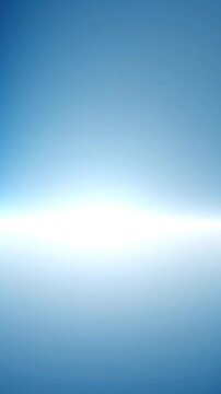 Bright white light horizontal flare beam illuminating soft blue gradient background in a dynamic motion video clip for abstract design