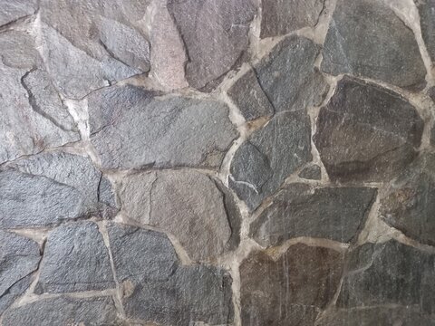 Natural Stone Wall Texture Background with Irregular Cut Stones