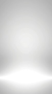 Empty studio background with soft white lighting and subtle gradient texture designed for professional video production and digital motion animation