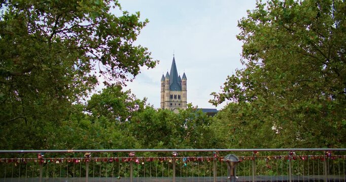 Historic Basilica Saint Martin Cologne Germany cityscape captures the remarkable architecture, tall church spires and historic urban scenery of a popular European travel destination.