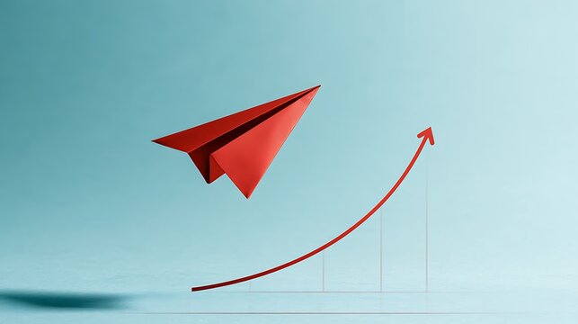 Red paper plane flying above growth chart on blue background
