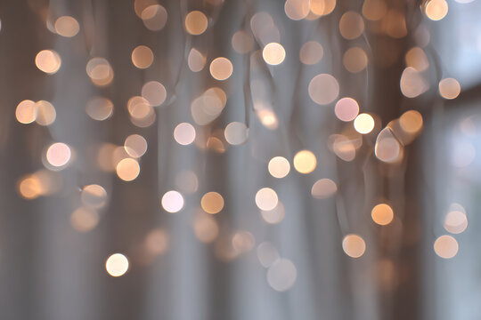 Sparkling light bokeh with warm golden colors for festive celebrations