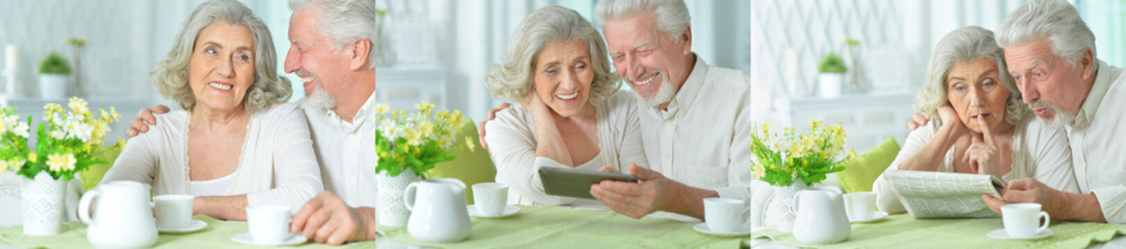 Happy senior couple using tablet at home during morning coffee