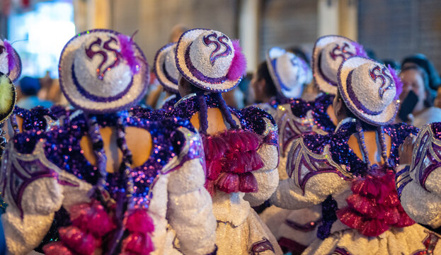 Close Up Details of Dancers in Colorful Traditional Costumes and Masks at a Peruvian Folk Dance Festival Parade