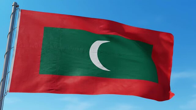 Waving Maldivian flag with red border and crescent moon symbol against clear blue sky, national symbol, footage