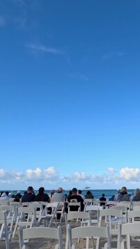 Spectators watching airplane aerobatics over the ocean at Surfers Paradise Australia