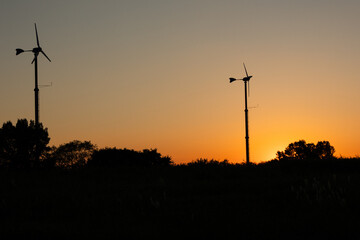 sunset silhouette of wind turbines  © 지혜 김