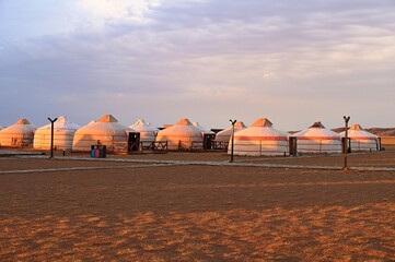 Yurt camp in Gobi Desert during sunset © Vedrana