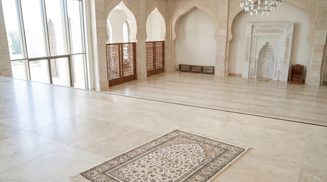 Elegant patterned prayer rug placed on polished marble floor inside bright modern mosque architectural space interior