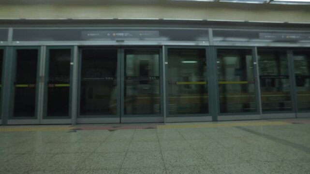 Framed Glass Sliding Platform Screen Doors Line A Train And Subway Station Platform. Static Shot