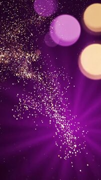 Golden glitter particles drifting gracefully across deep purple background creating elegant light motion animation for luxury festive event commercial footage