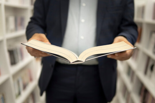 professor teacher buys a textbook in a bookstore. student reading book in library, university education