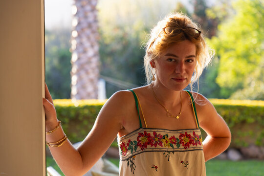 portrait of beautiful young woman backlit with sunset light