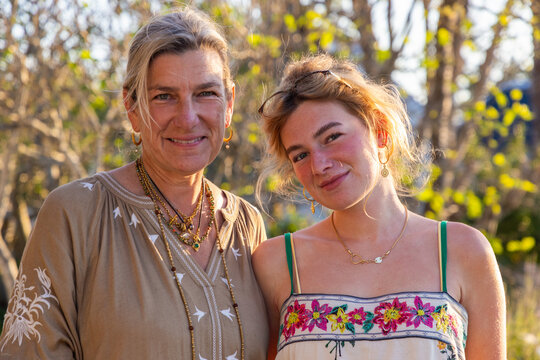 portrait of mother and 20 year old daughter in natural light smiling