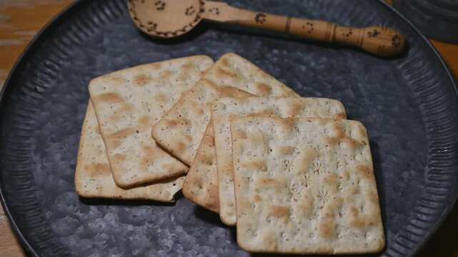Vintage Metal Plate with Soda Crackers and Hand Carved Wooden Spoon