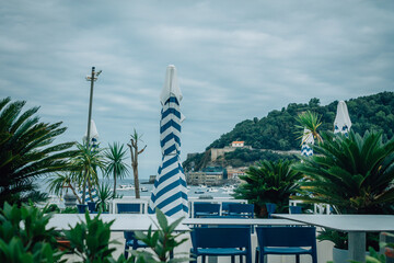 Obraz premium outdoor restaurant overlooking La Concha Bay in San Sebastian, Basque Country, Spain