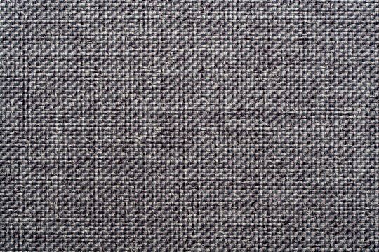 Grey upholstery fabric texture background with canvas weave. Closeup gray textile material canvas background abstract dark melange cotton or linen pattern for furniture upholstery garment wallpaper